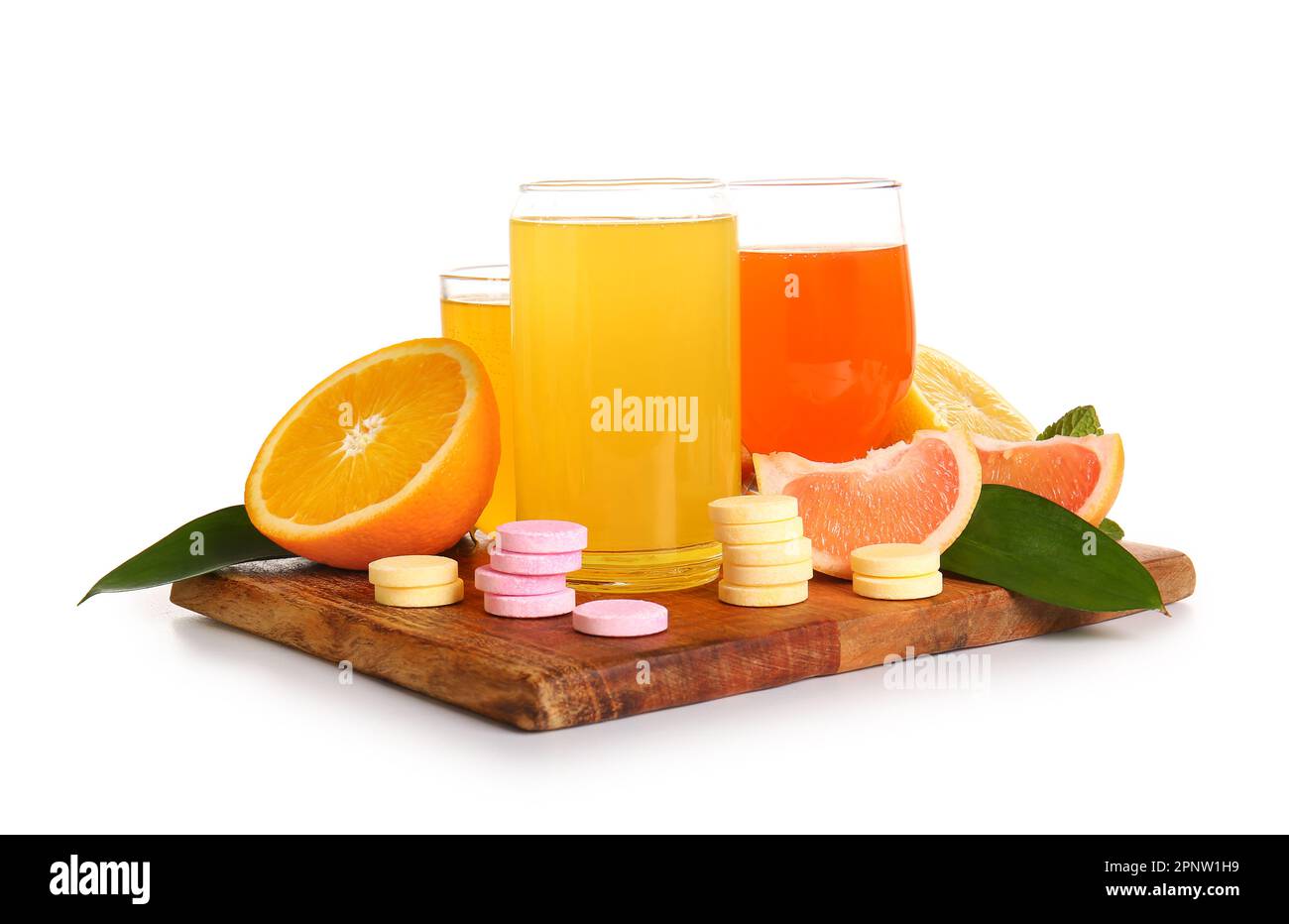 Board with glasses of vitamin C effervescent tablet dissolved in water
