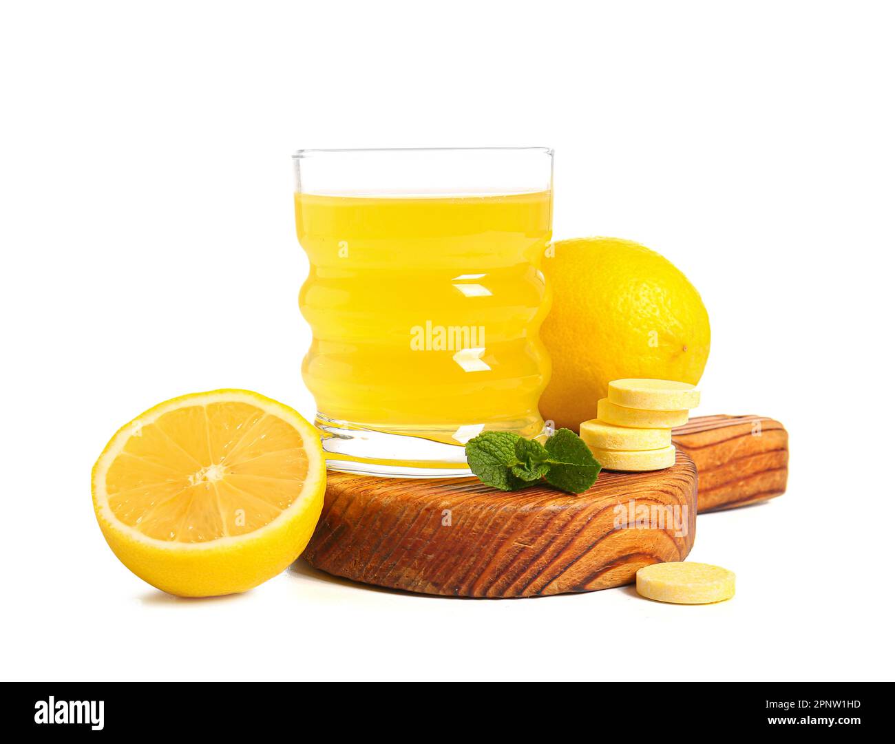 Board with glass of vitamin C effervescent tablet dissolved in water