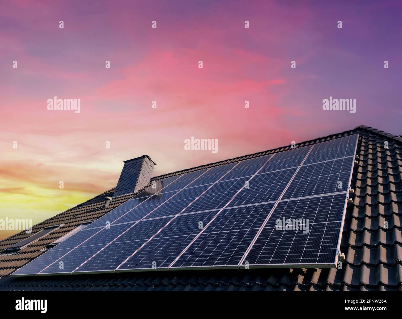 Solar panels producing clean energy on a roof of a residential house ...