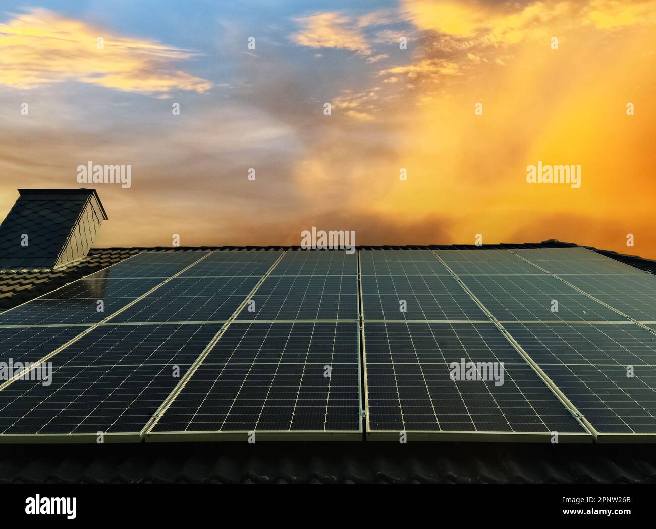 Solar panels producing clean energy on a roof of a residential house ...