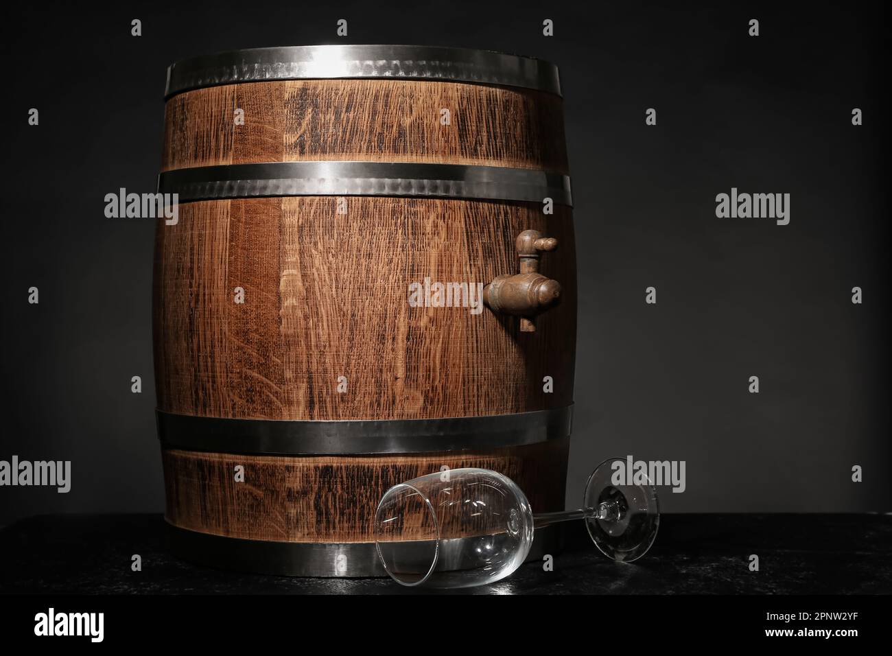 Oak barrel with wine glass on dark background Stock Photo - Alamy