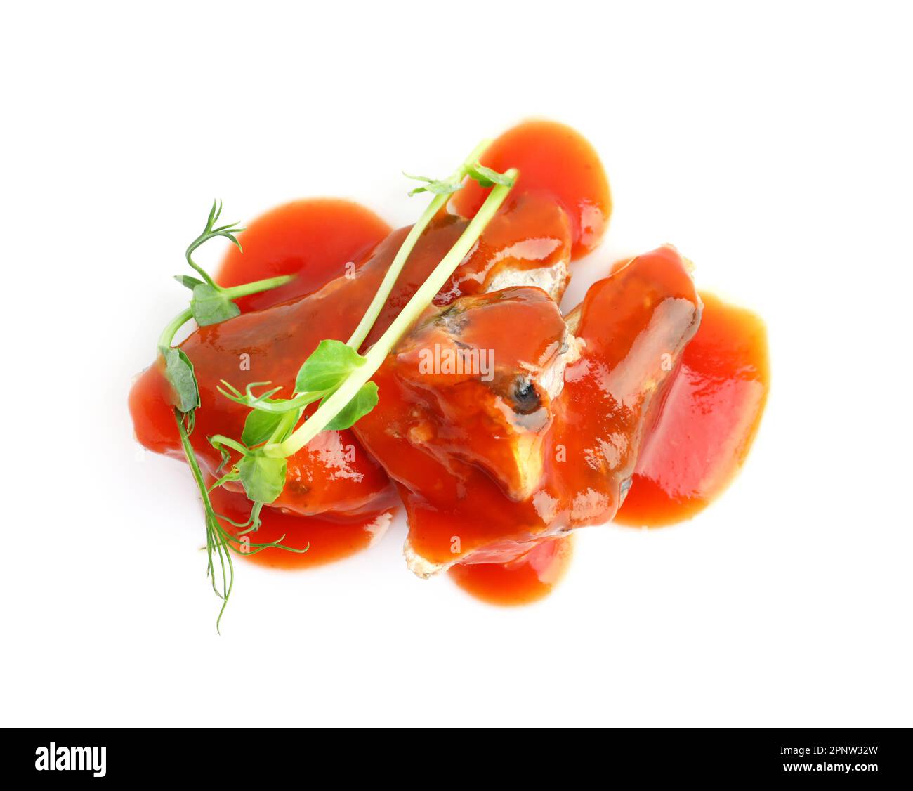 Canned fish in tomato sauce with microgreens isolated on white