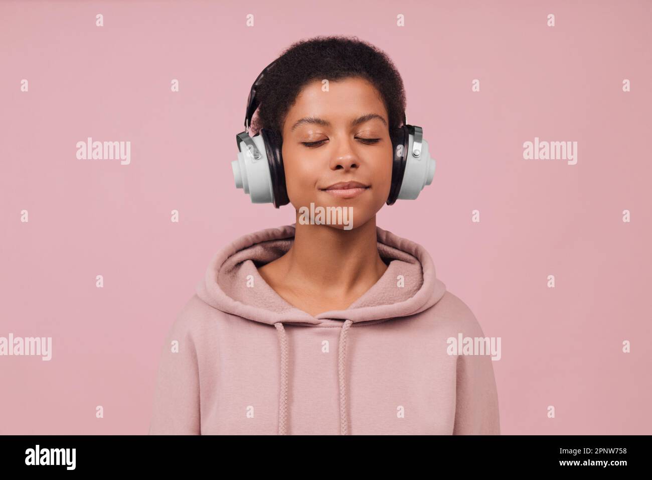 The Girl Wears Modern Wireless Headphones And Indulges In The Melodies That  Enter Her World High-Res Stock Photo - Getty Images
