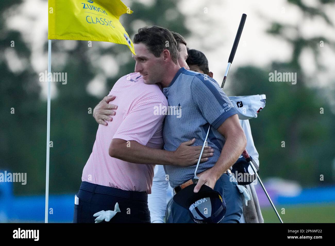 Sean OHair, left, greets teammate Brandon Matthews after finishing the day on the 18th green during the first round of the PGA Zurich Classic golf tournament at TPC Louisiana in Avondale, La.,