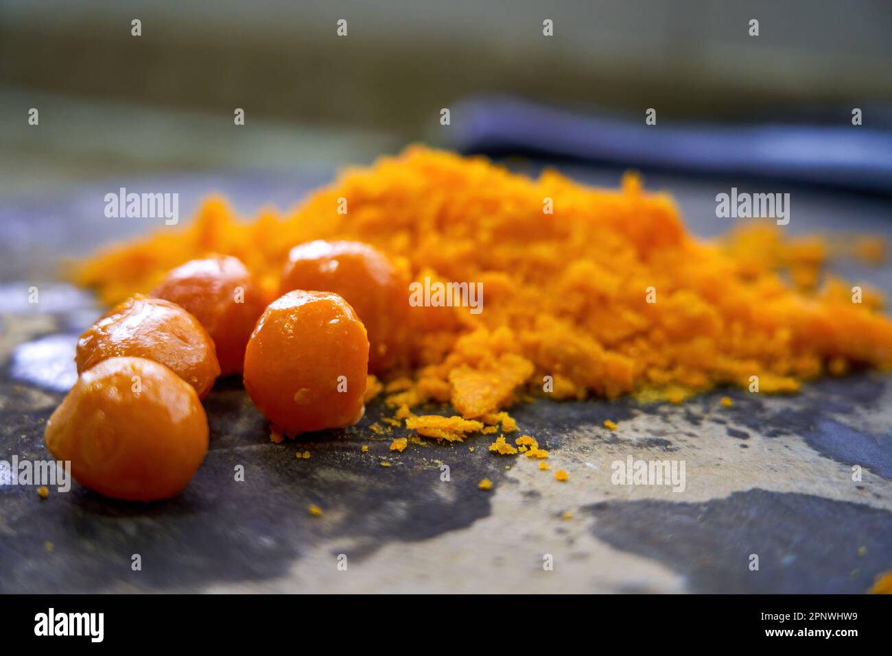 A chef is chopping salted egg yolk in the kitchen Stock Photo Alamy