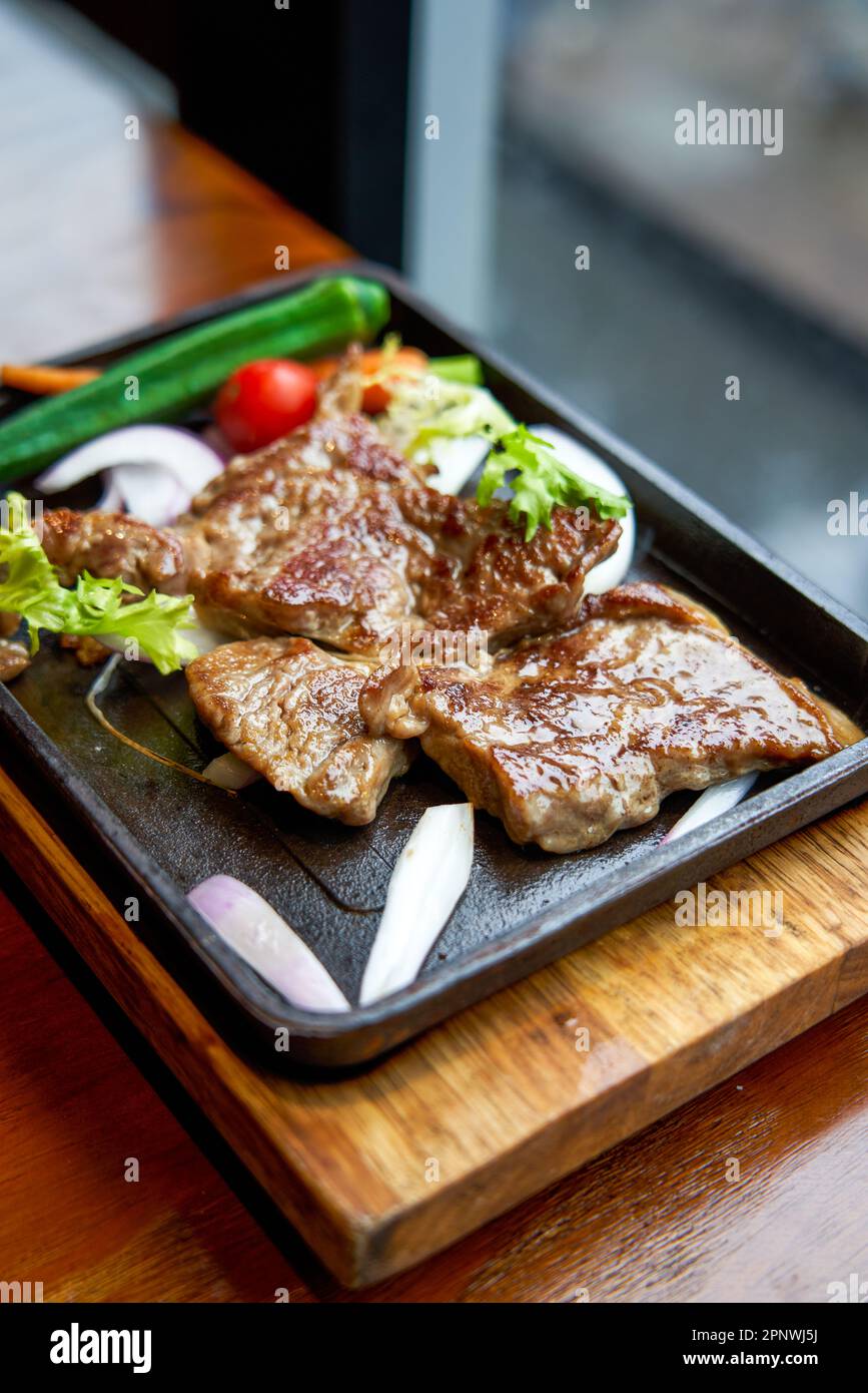 A delicious ribeye steak in a western restaurant Stock Photo Alamy