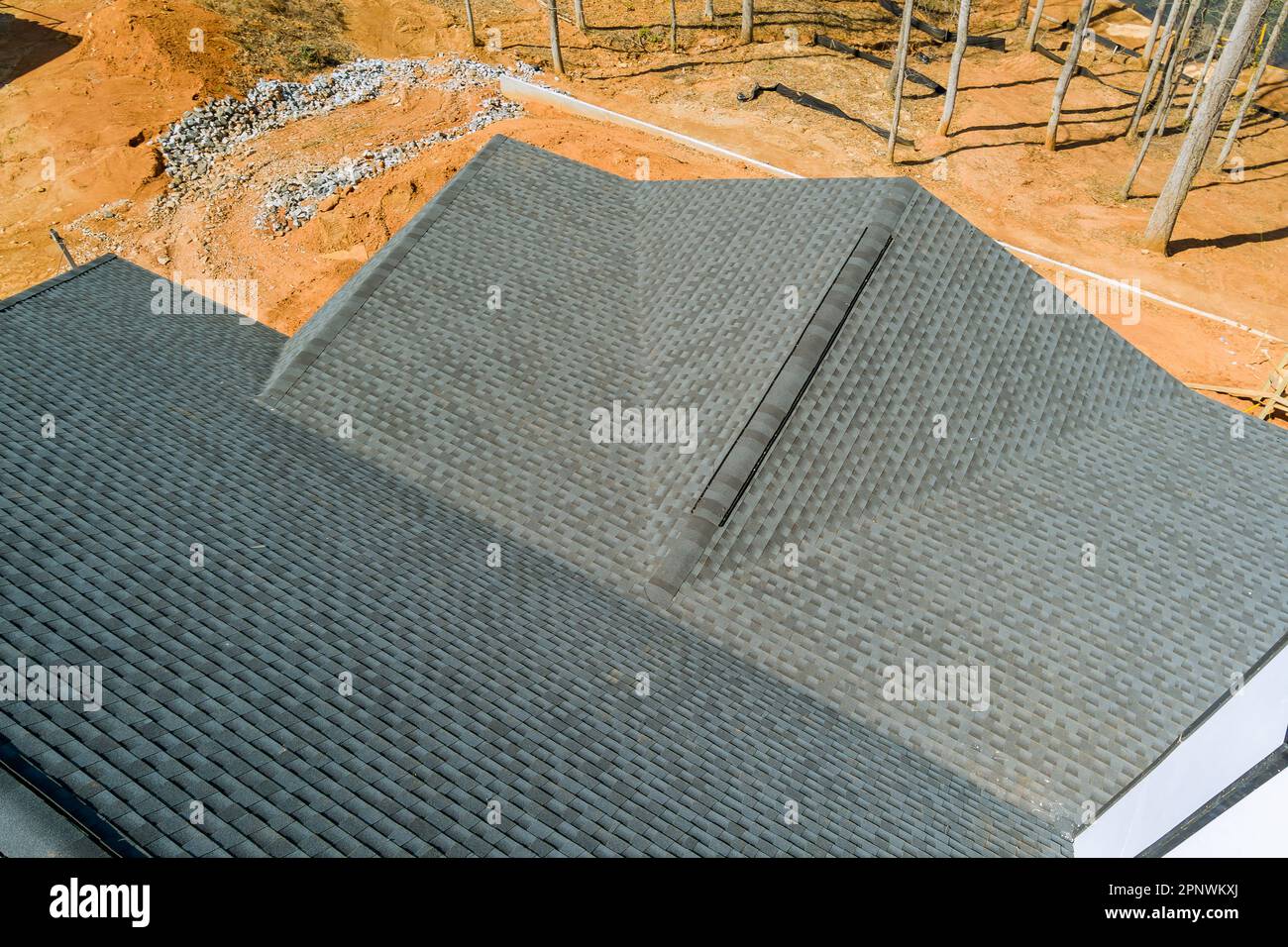 As soon as asphalt shingles are installed covering new house quality of