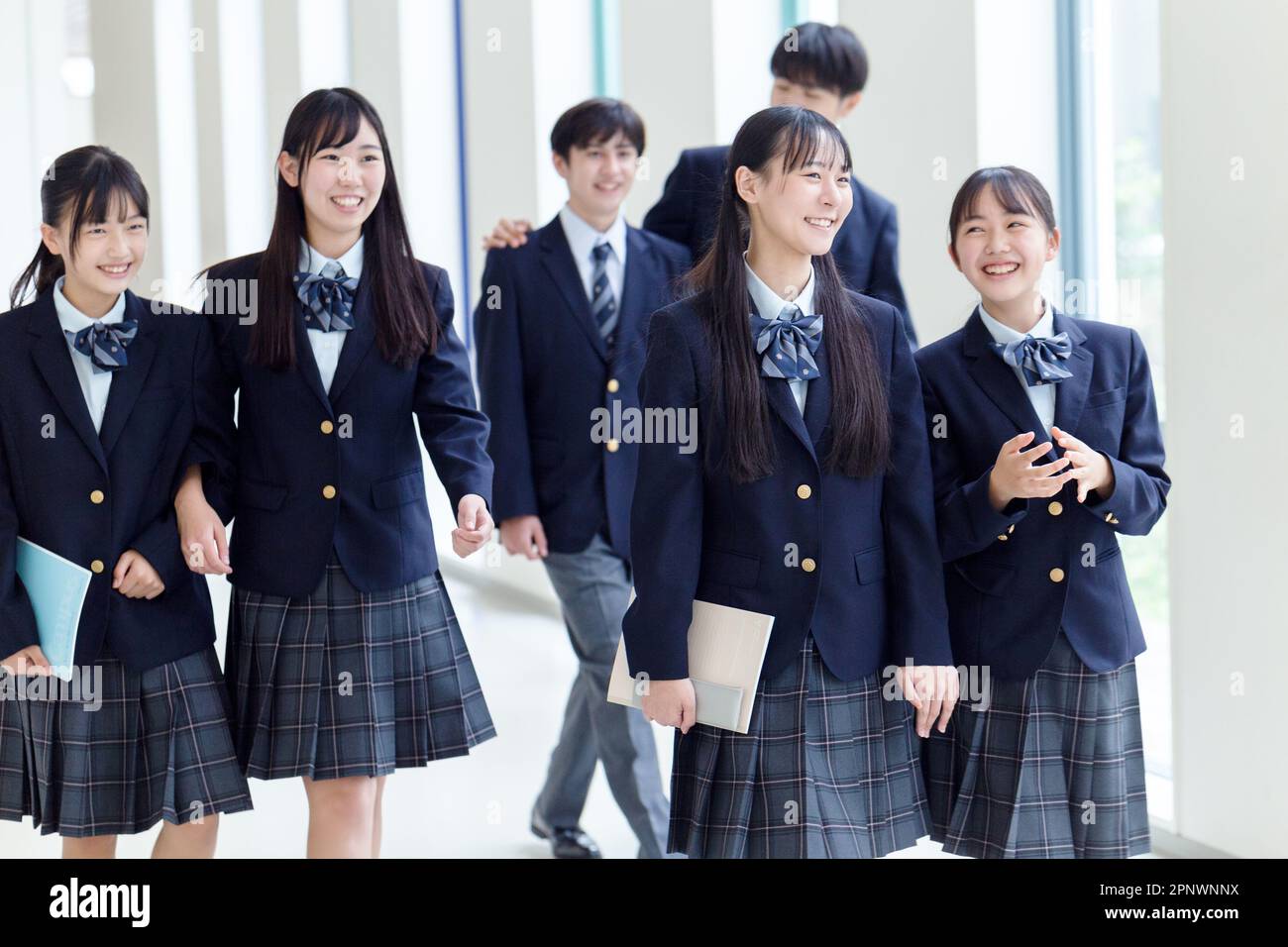 High school students walking in the hallway Stock Photo - Alamy