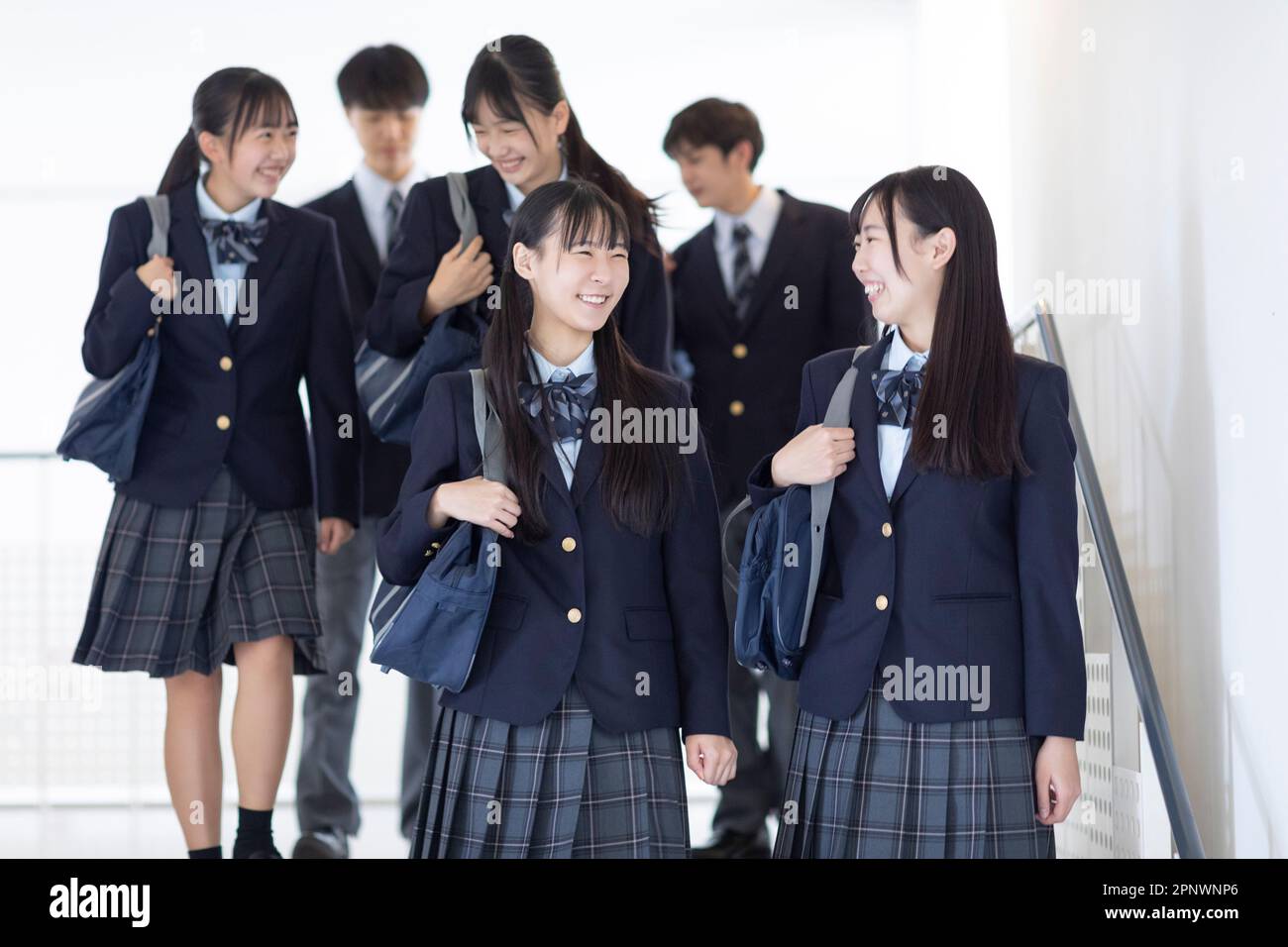 High school students walking in the hallway Stock Photo - Alamy