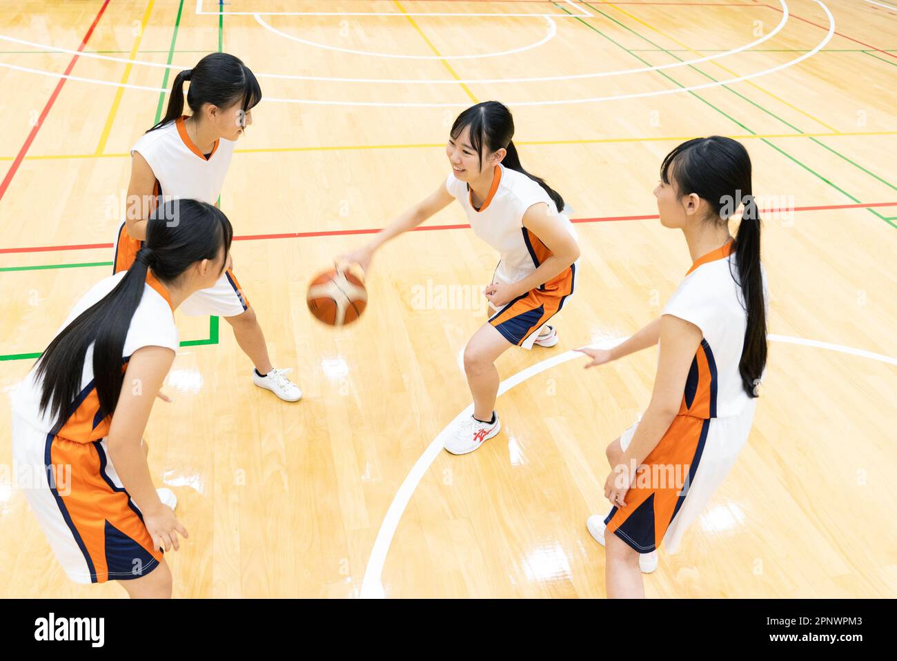 High school students playing basketball Stock Photo