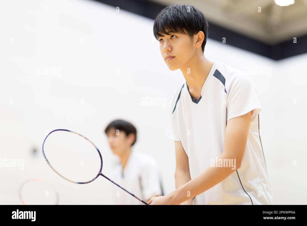 A high school student holding a badminton racket Stock Photo Alamy
