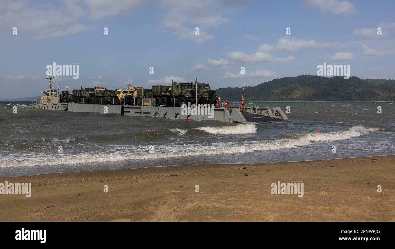 An Improved Navy Lighterage System drops its ramp during combined joint logistics overtheshore