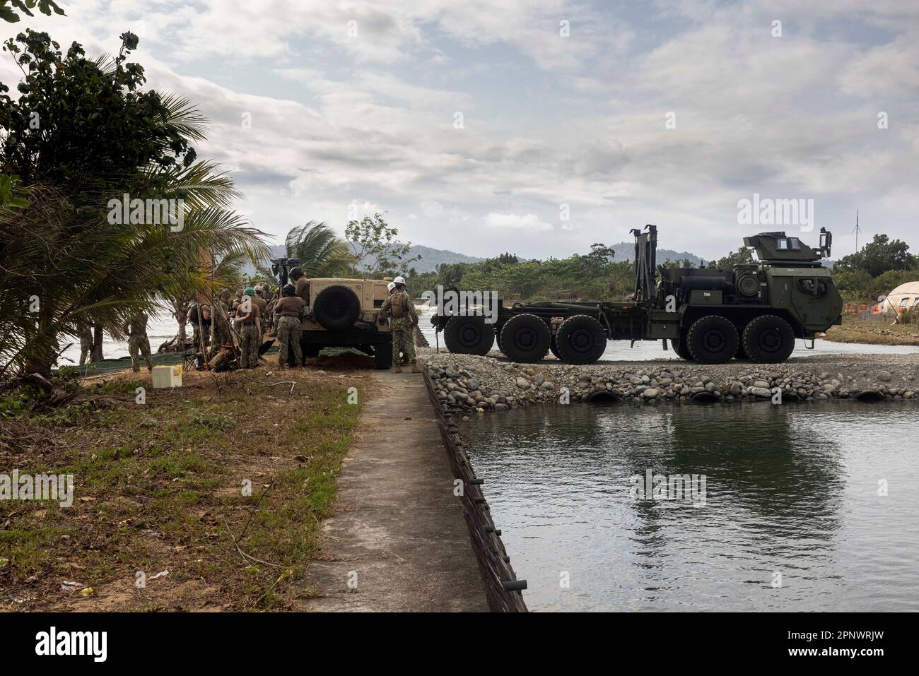 A U.S. Marine Corps Logistic Vehicle Service Replacement with 3rd Landing Support Battalion, reverses during combined joint logistics over-the-shore operations in preparation for Balikatan 23 at Camp Agnew, Casiguran, Philippines, April 9, 2023. A combined force of logisticians and support personnel from the Armed Forces of the Philippines and the U.S. military are planning and executing a combined joint logistics over-the-shore event during Balikatan 2023, the annual bilateral exercise between the two Allies. This complex process increases their mutual proficiency in supplying forces ashore i Stock Photo