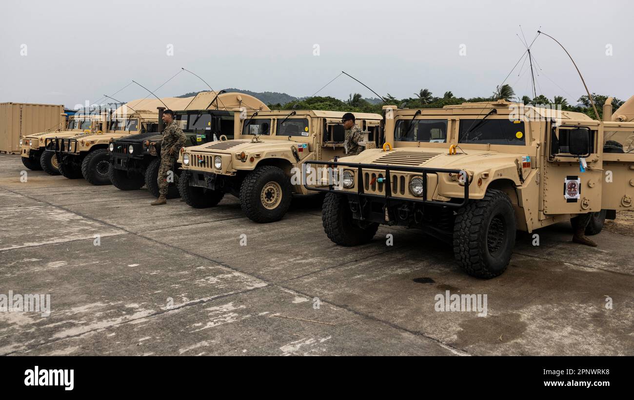 U.S. Marines with 3rd Landing Support Battalion, stage their vehicles after finishing a convoy during combined joint off-the-shore operations in the Philippines on April 11, 2023. A combined force of logisticians and support personnel from the Armed Forces of the Philippines and the U.S. military are planning and executing a combined joint logistics over-the-shore event during Balikatan 23, the annual bilateral exercise between the two Allies. This complex process increases their mutual proficiency in supplying forces ashore in an expeditionary environment.  (U.S. Marine Corps photo by Staff S Stock Photo