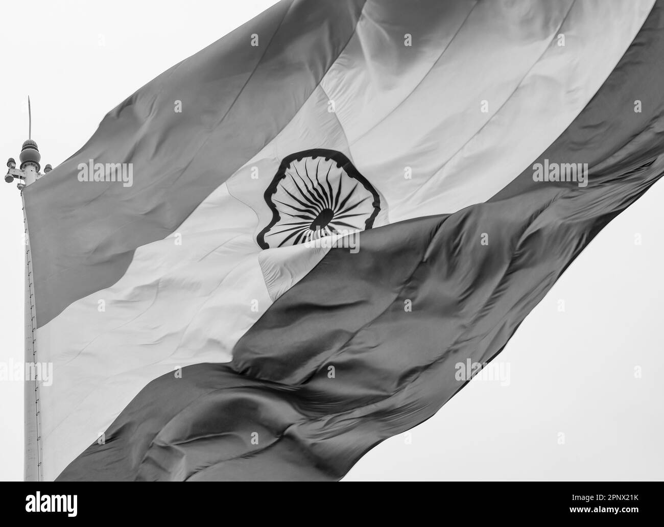 India flag flying high at Connaught Place with pride in blue sky, India