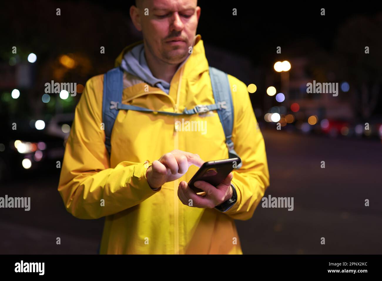 Navigate Man Man uses navigation on smartphone to find way to station Stock Photo ...
