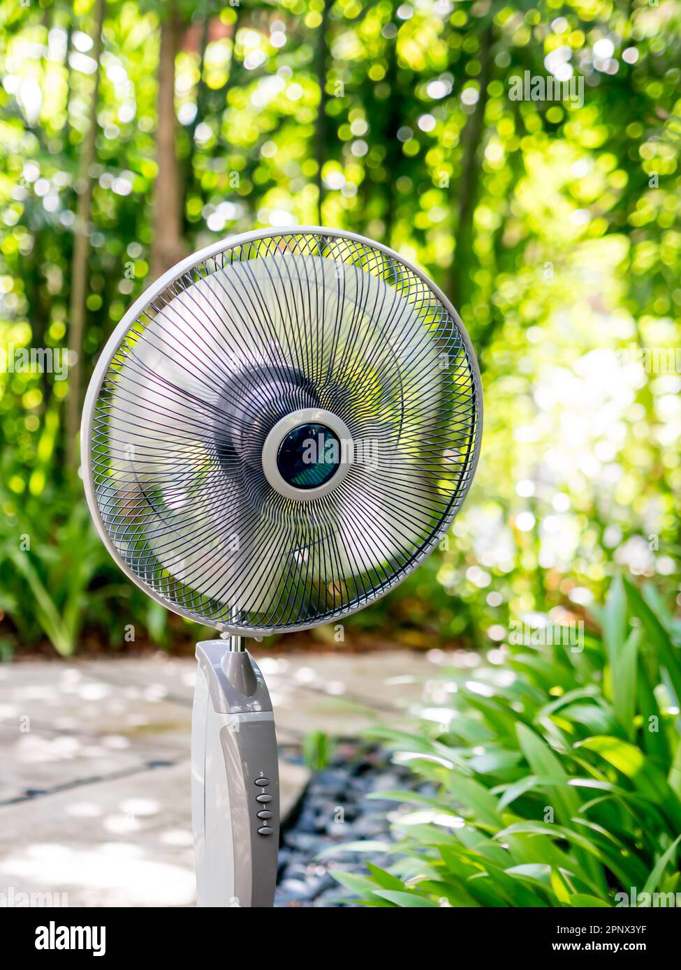 The  electric table fan in the garden Stock Photo