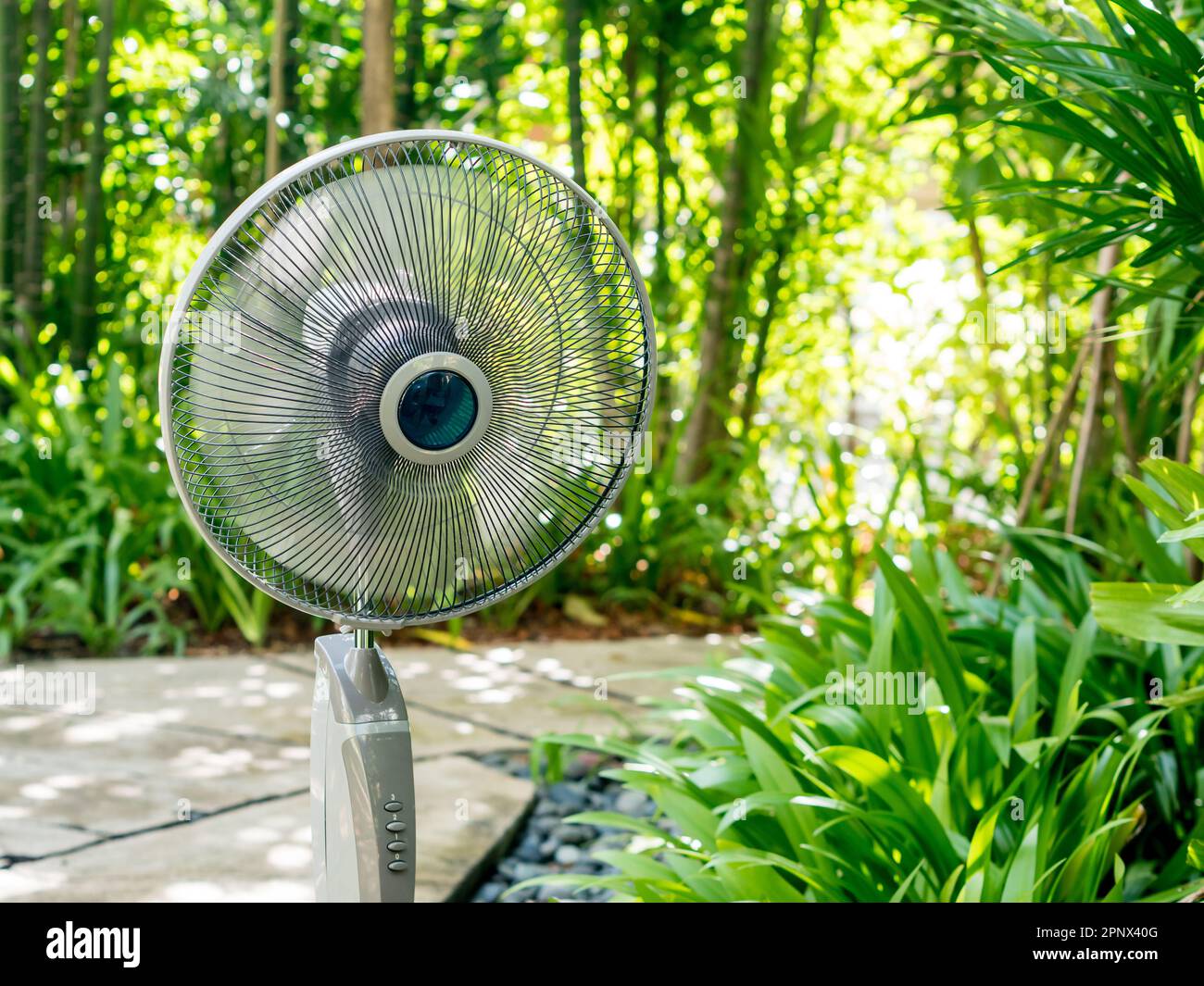 The  electric table fan in the garden Stock Photo