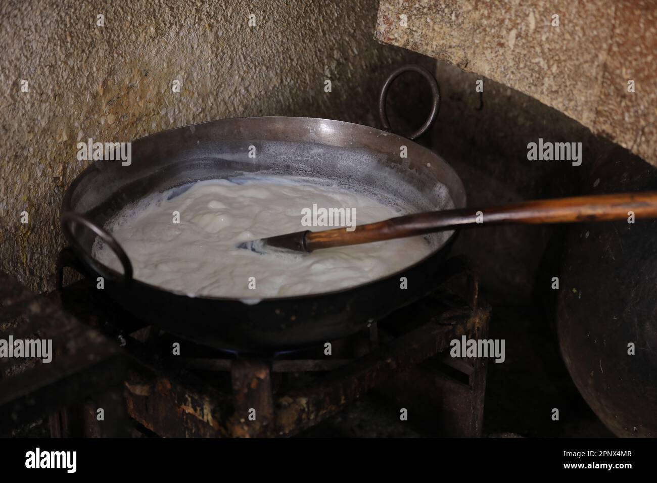 Frying kachori in a Frying Pan at a street food stall , oily food Stock
