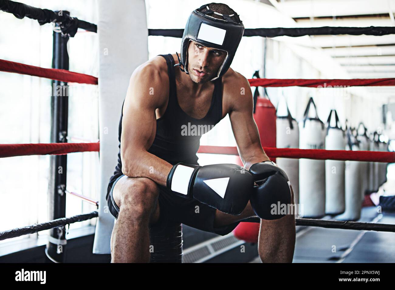 Driven by the boxing dream. a young man training in a boxing ring Stock