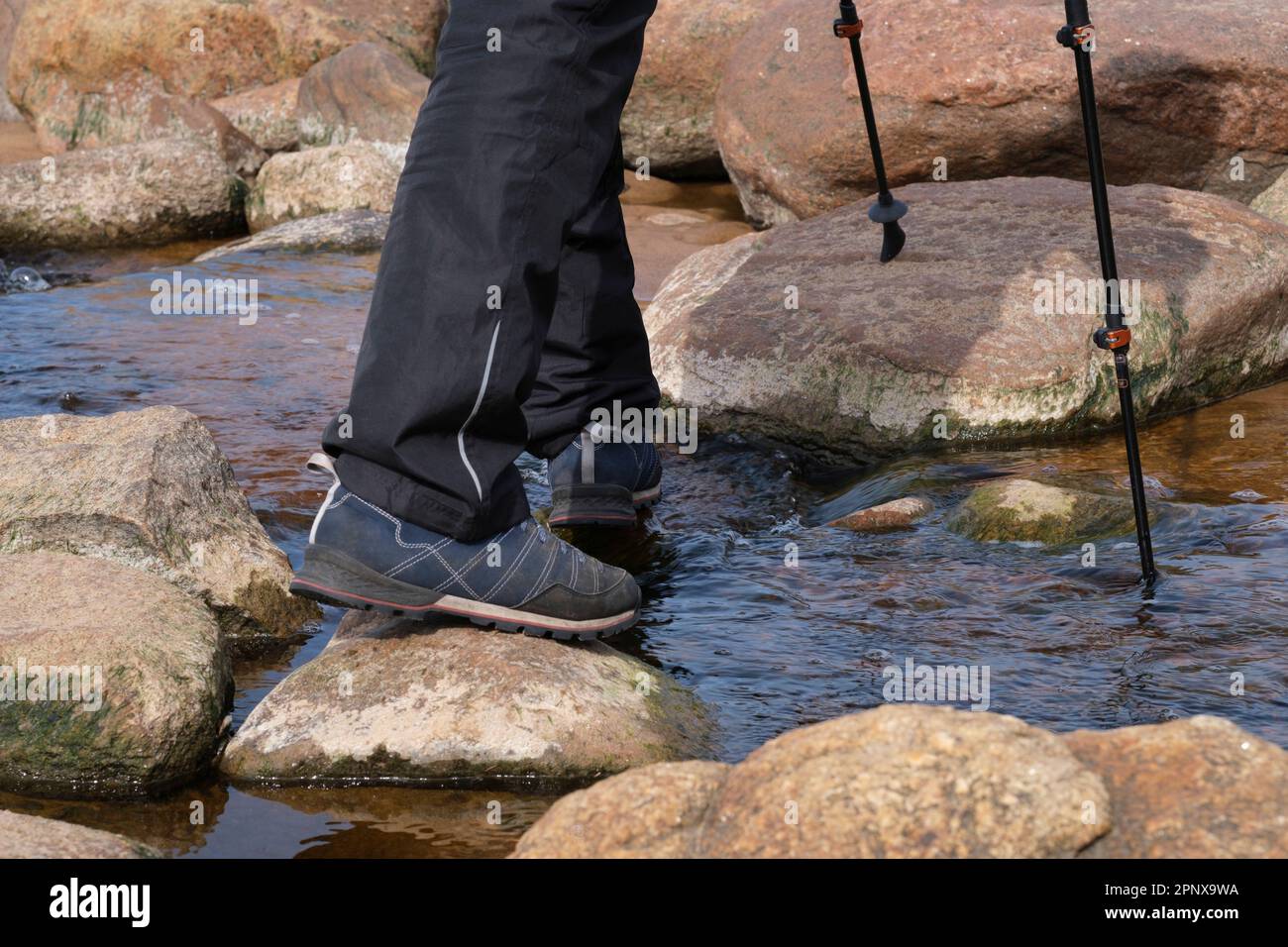 Crossing small stream trekking hi-res stock photography and images - Alamy