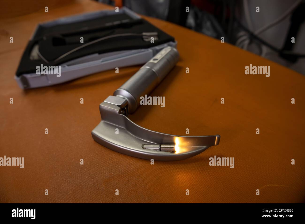 A laryngoscope is an instrument used to examine the larynx Stock Photo Alamy