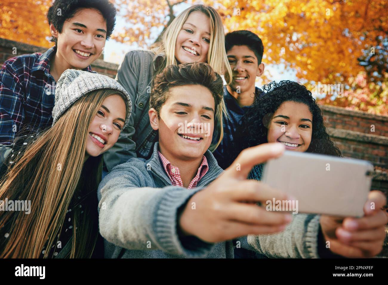 Selfie with friends. Friendly smiling teenagers making group photo
