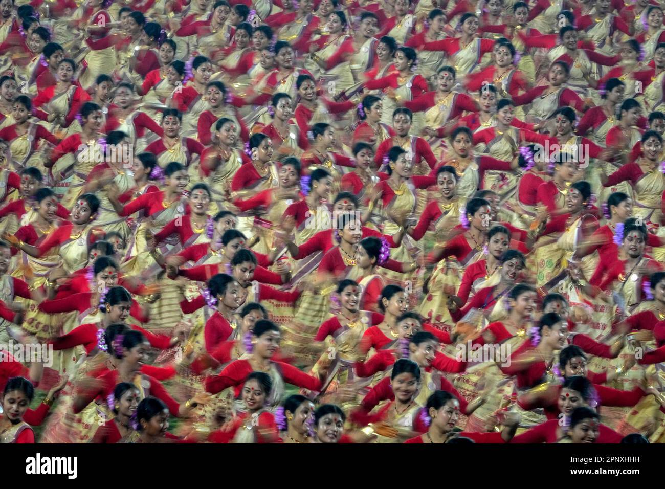 Assamese dancers in traditional attire perform as they attempt Guinness