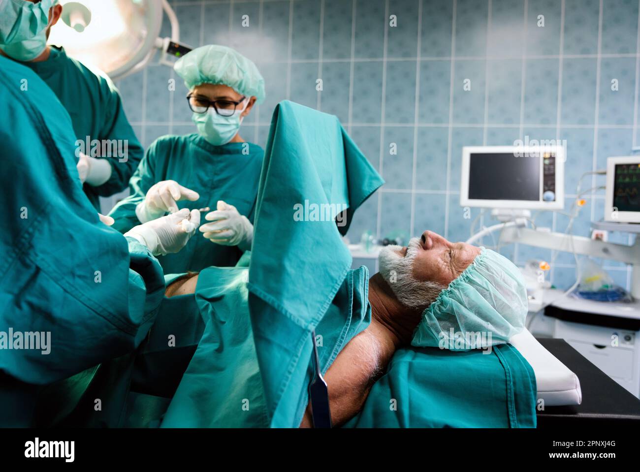Group of surgeon doctor team at work in operating room Stock Photo - Alamy