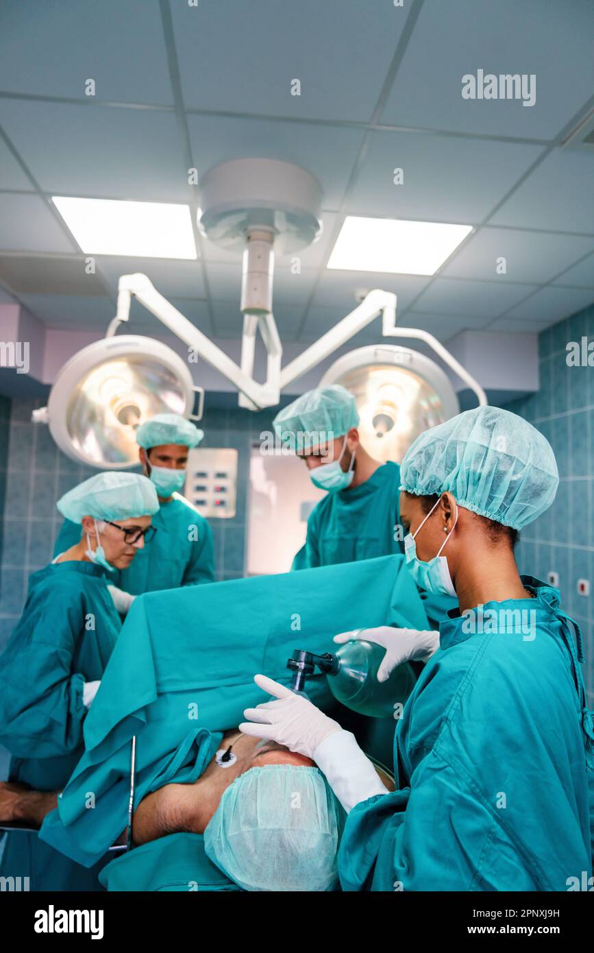 Group of surgeon doctor team at work in operating room Stock Photo - Alamy