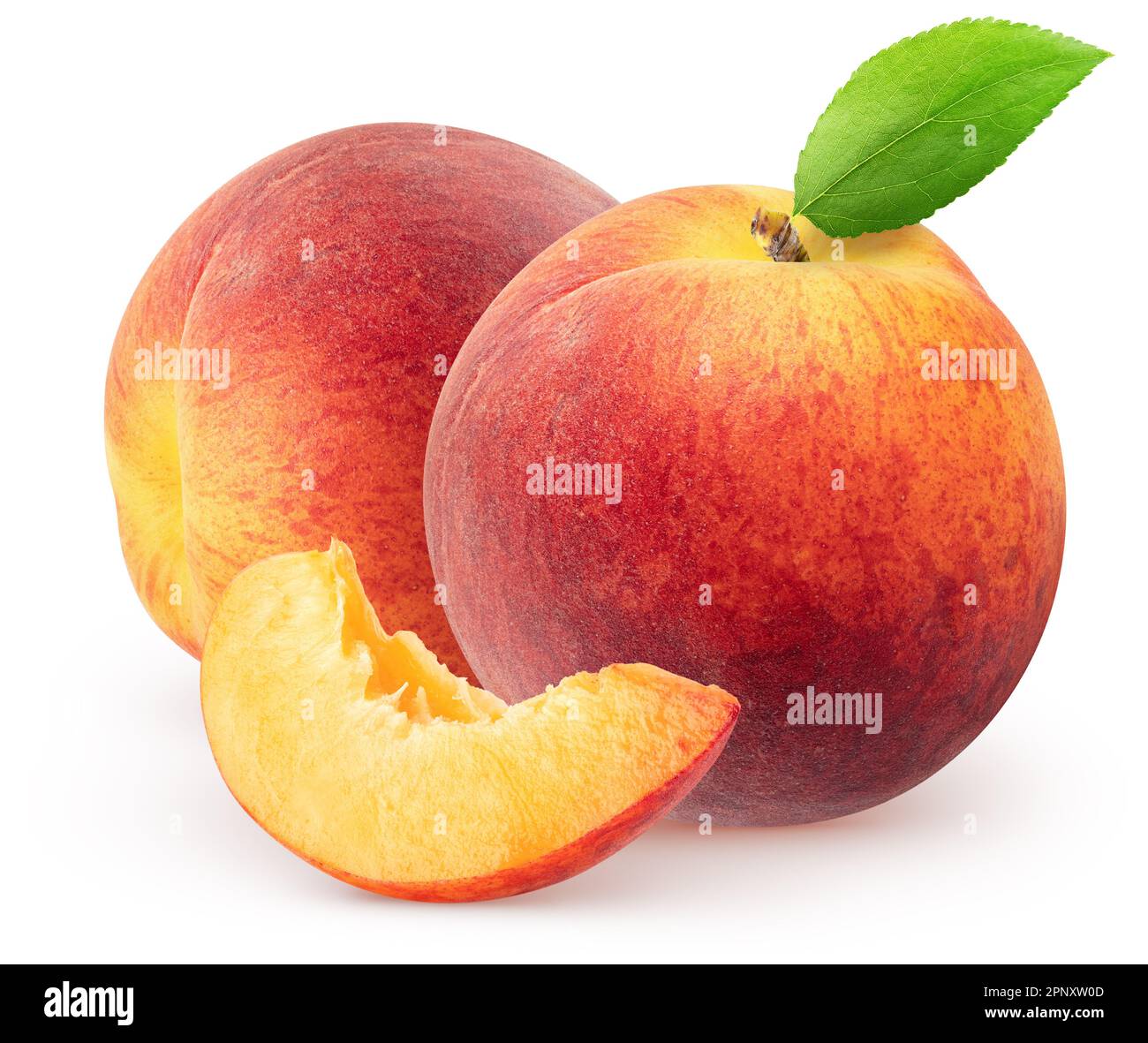 Isolated peaches. Two whole peach fruits with leaf and piece isolated