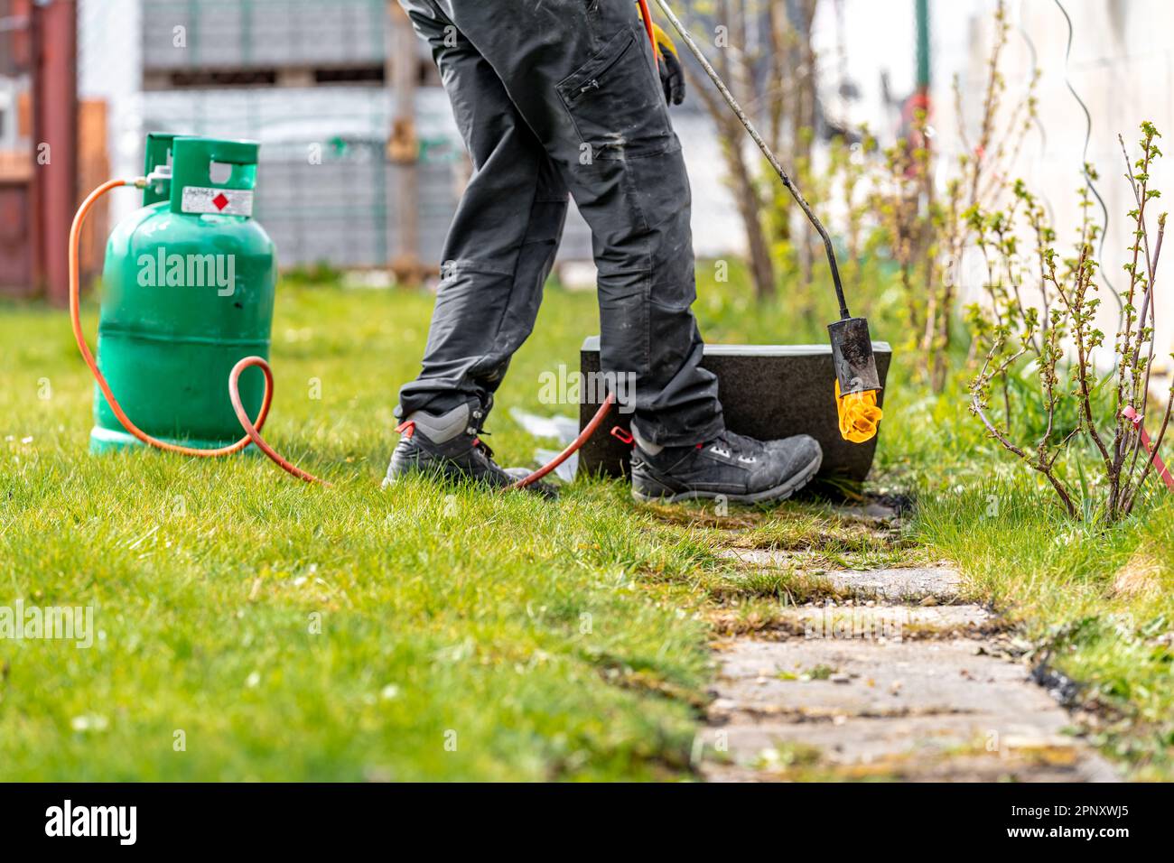 work with an open fire from a gas bomb on a construction site Stock