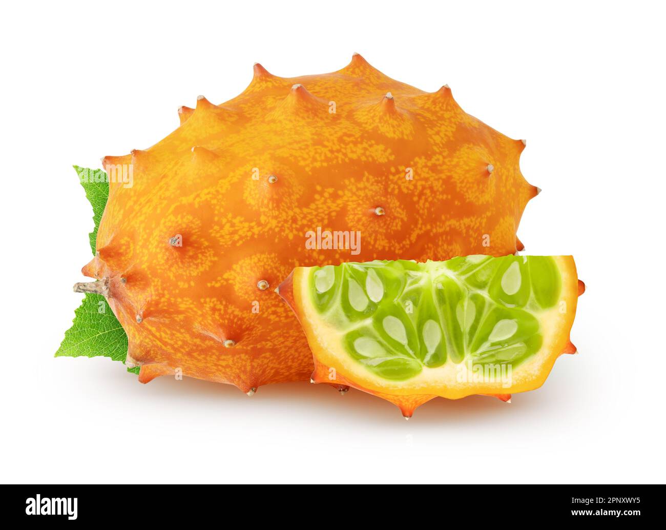 Isolated kiwanos. One fresh kiwano melon fruit and a piece with leaves