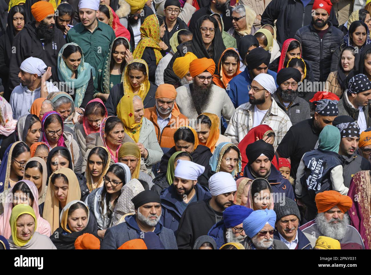 Gravesend, Kent, UK. Annual Vaisakhi celebrations in the town centre. Sikh men in turbans and women with colourful headscarves. 15th April 2023. Stock Photo
