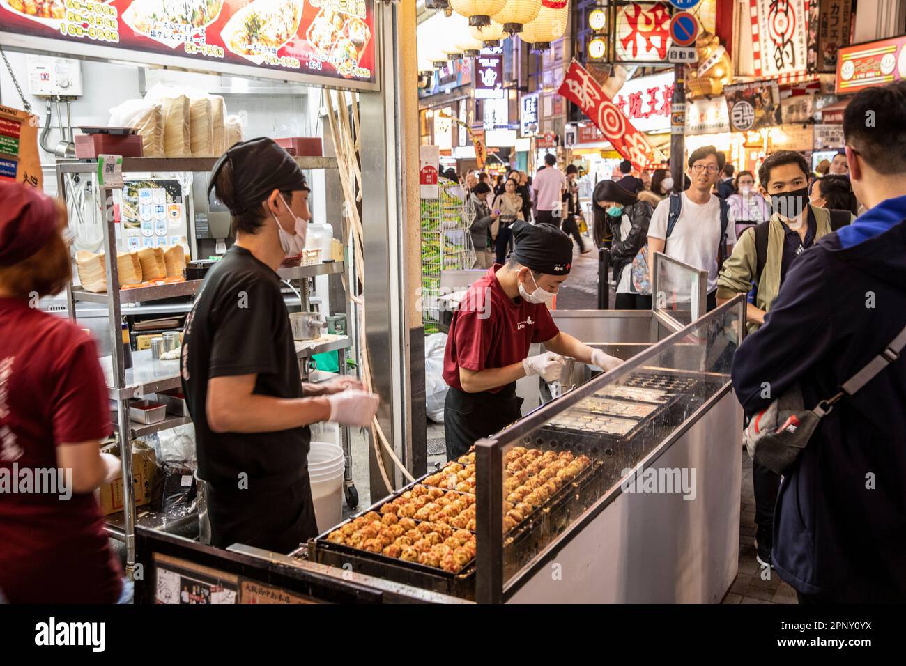 Osaka Japan April 2023 Japanese chefs prepare takoyaki octopus balls street food in Dotonbori district of Osaka,Japan,Asia Stock Photo
