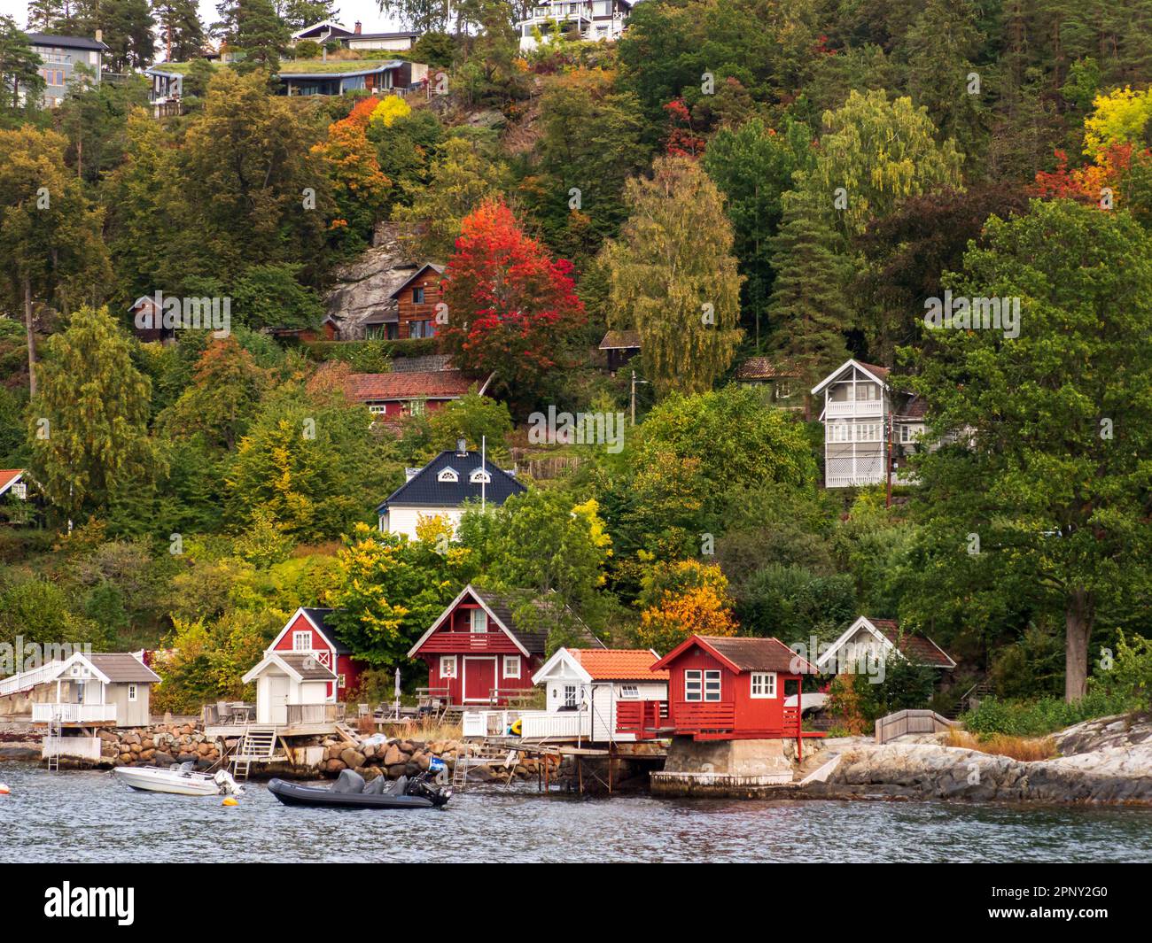 Nesoddtangen, Norway - Sep, 2022: Bath houses on the seaside overlooking the fjord  seen from the sighting tour on the Oslo Fjord near Oslo, municipal Stock Photo
