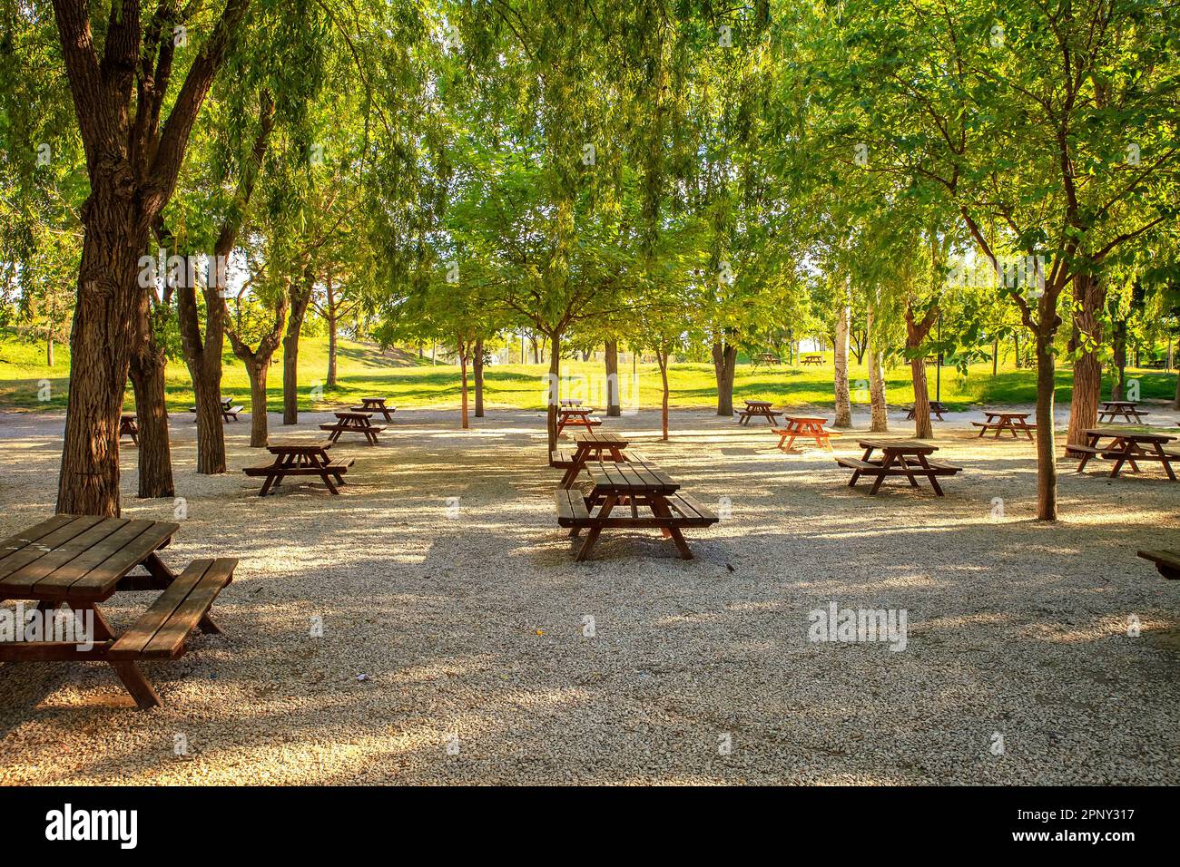 tranquil scene with picnic tables in the countryside Stock Photo