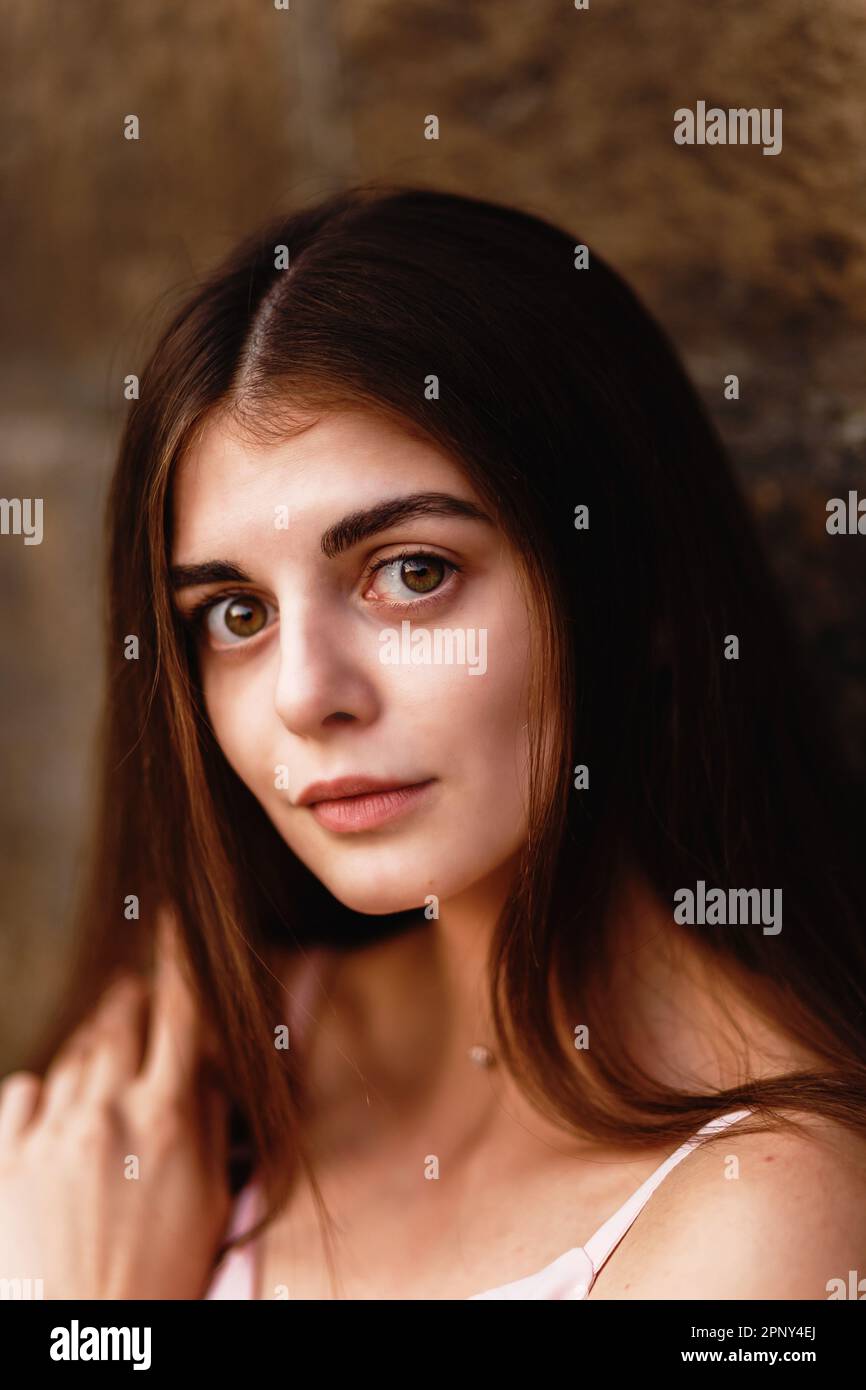 Portrait of a girl with big eyes in a pink dress Stock Photo - Alamy