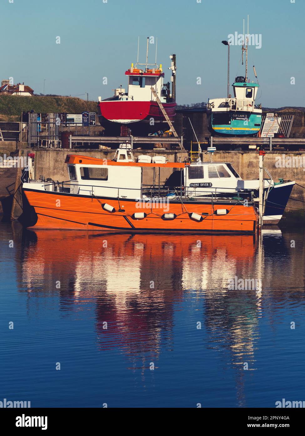 A boat in the harbour at Seahouses, Northumberland Stock Photo - Alamy