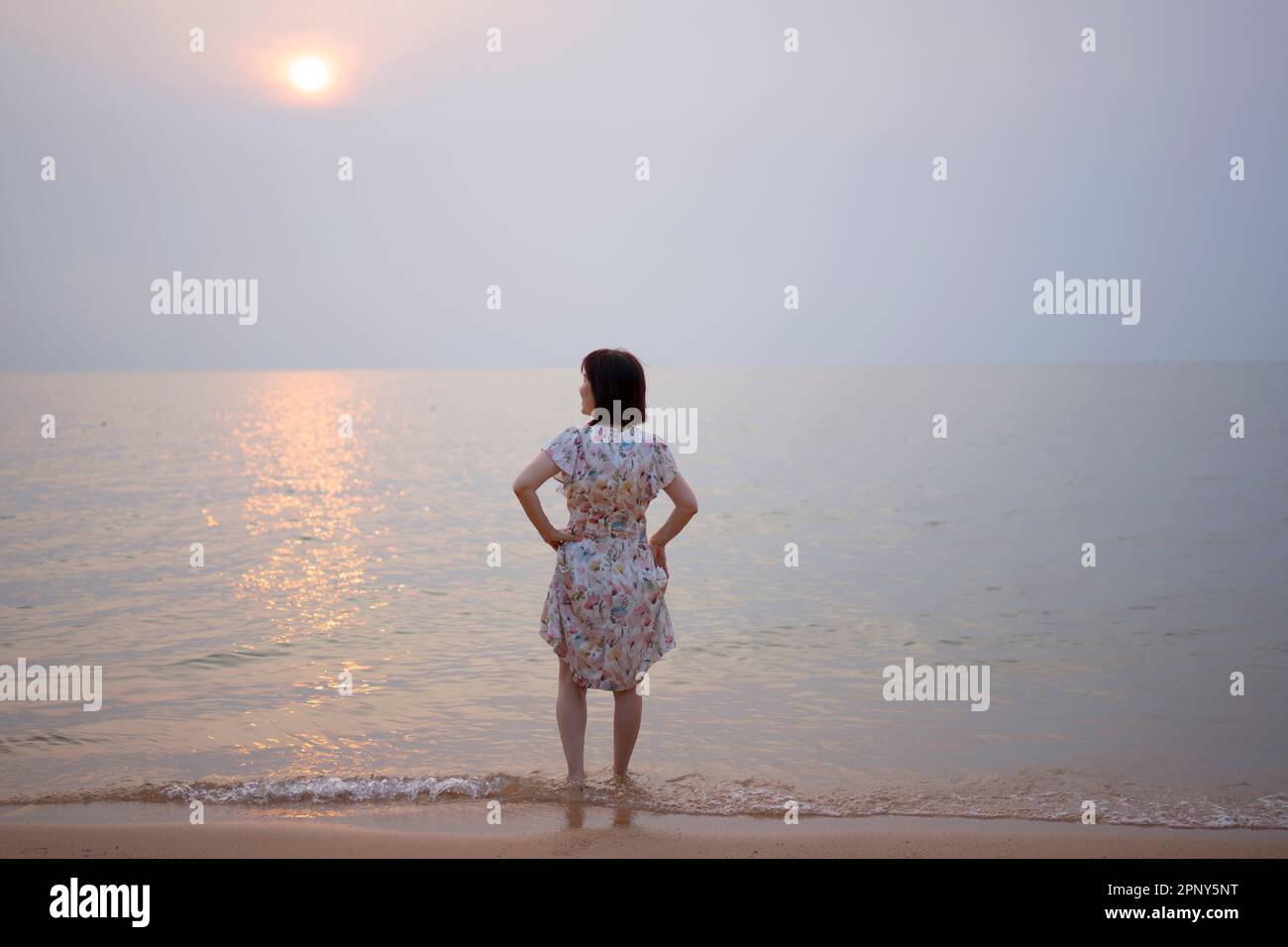 Mature woman on vacation and work. travel and working any time any where concept. Stock Photo