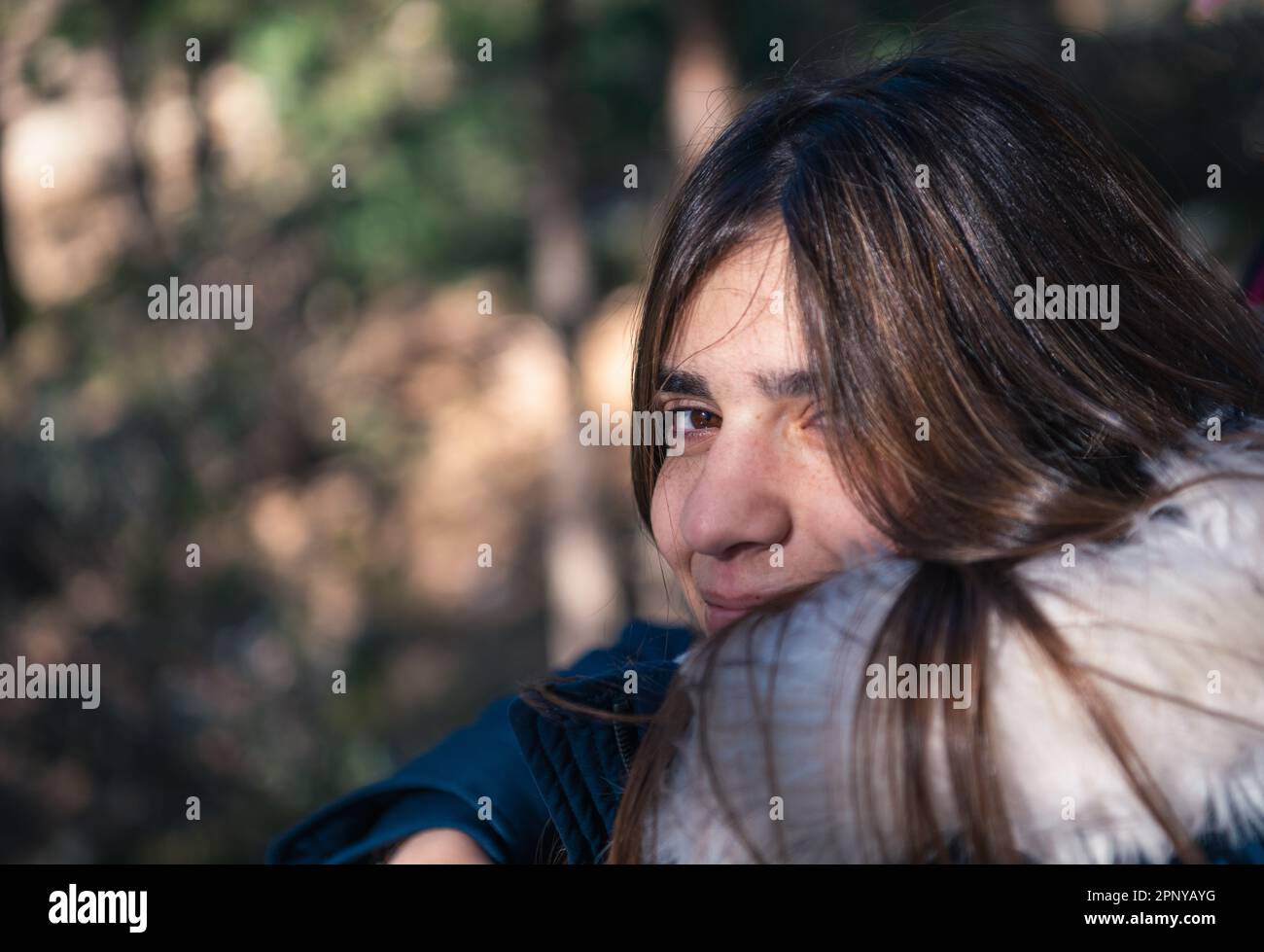 Portrait of a happy girl in blue coat in the forest Stock Photo - Alamy