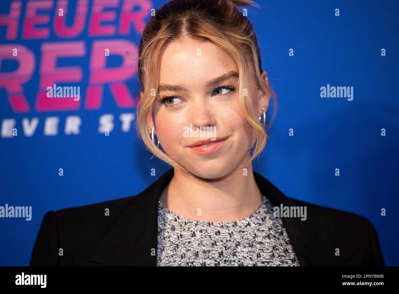 Milly Alcock poses for photographers upon arrival at the TAG Heuer