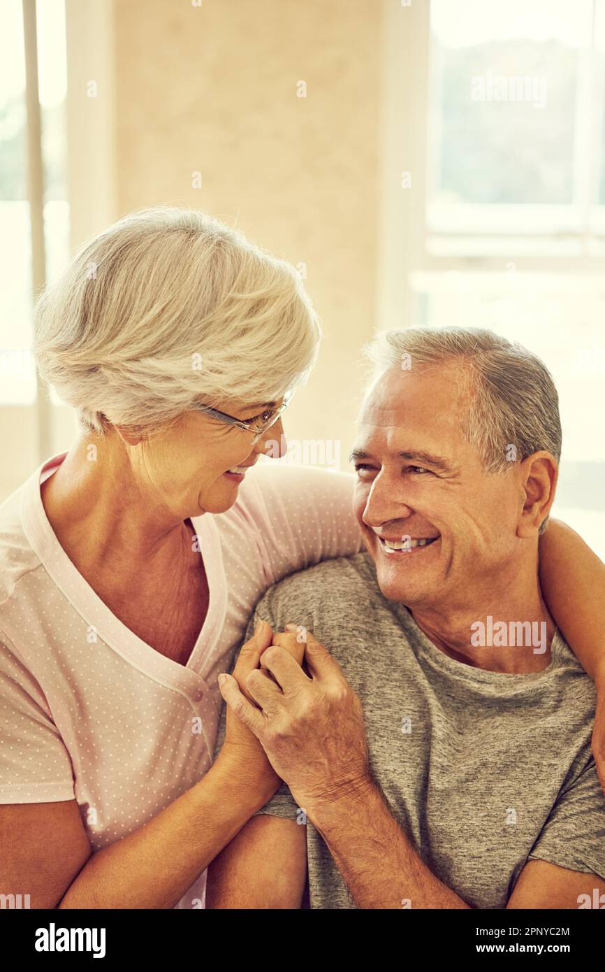 Old couple embracing in bed hi-res stock photography and images - Alamy