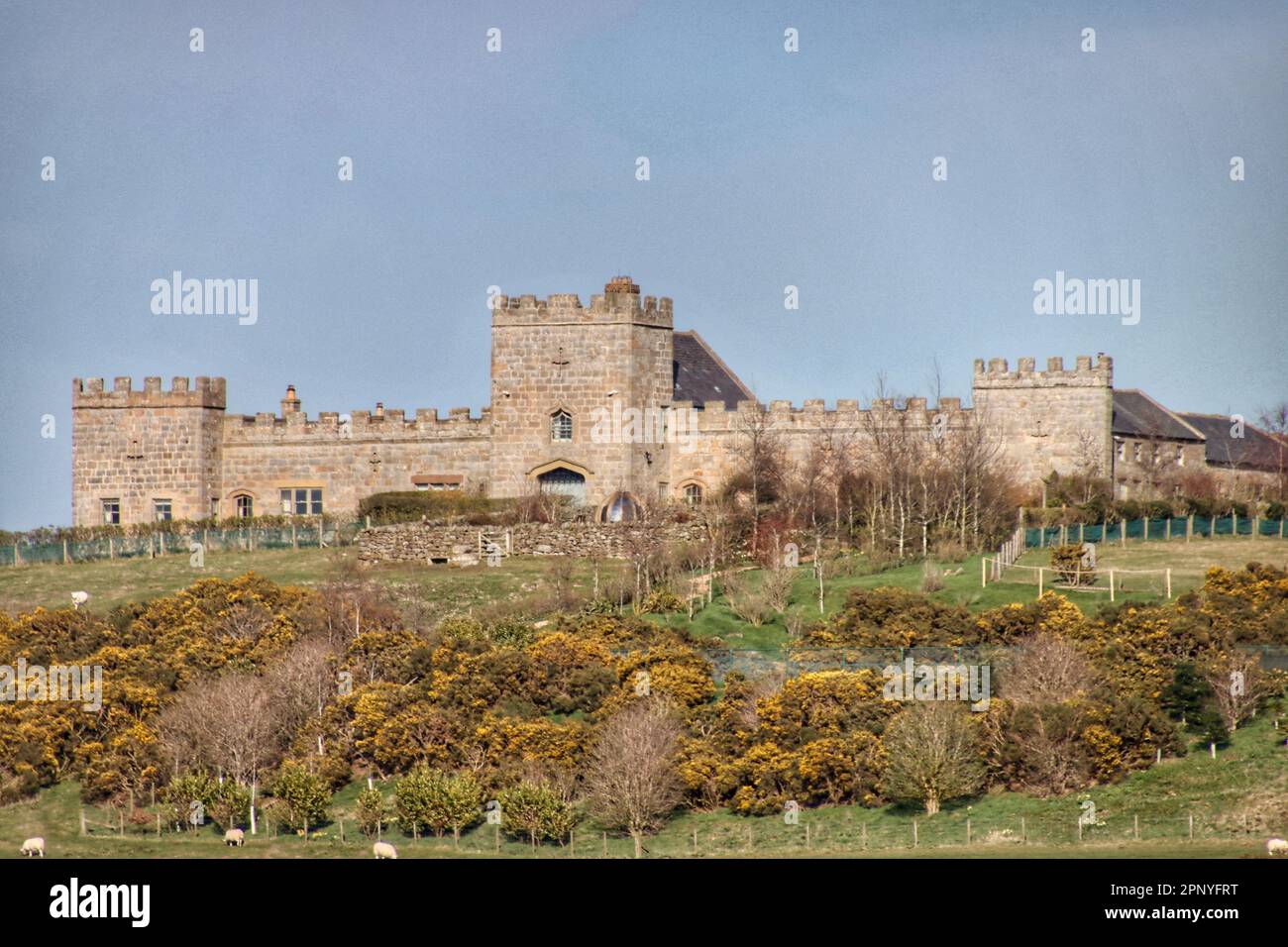 A landscape of an ancient castle on the green hill in Lemmington Stock Photo