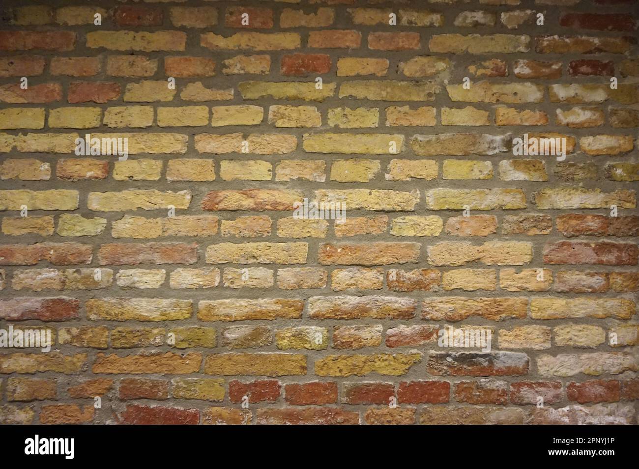 Old red, orange and yellow brick wall texture Stock Photo - Alamy