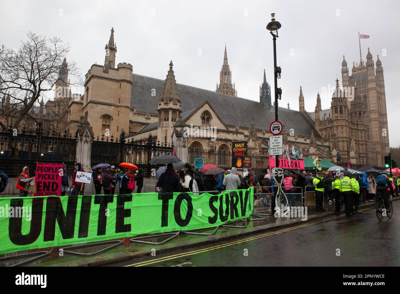 London, UK. 21st Apr, 2023. Extinction Rebellion protesters defied the rain in Westminster, with groups of protestors targeting different government ministries. A launch for 'The Big One' was held on College Green opposite the Houses of Parliament and protests will continue for the next 4 days. Credit: Anna Watson/Alamy Live News Stock Photo