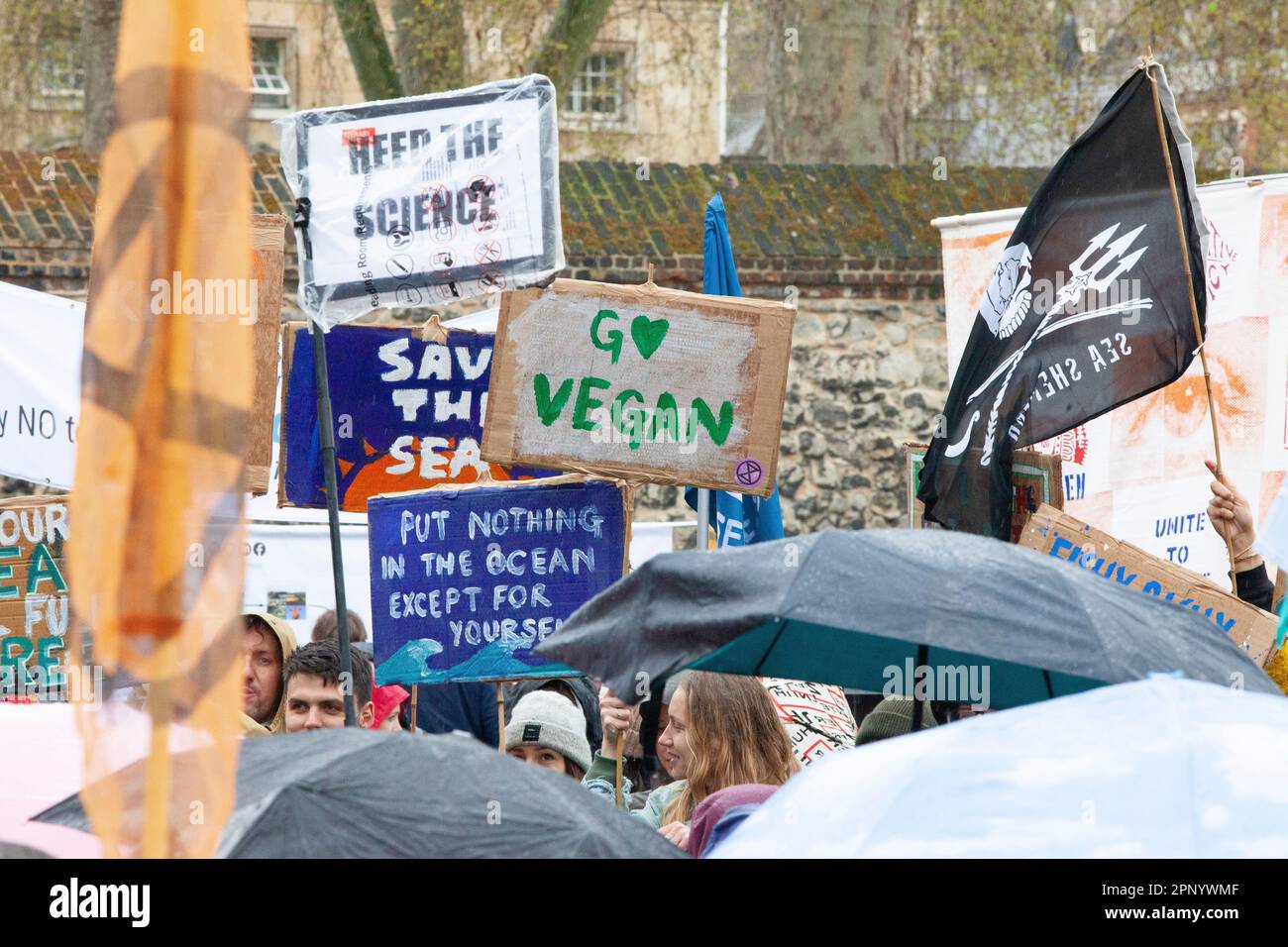 London, UK. 21st Apr, 2023. Extinction Rebellion protesters defied the rain in Westminster, with groups of protestors targeting different government ministries. A launch for 'The Big One' was held on College Green opposite the Houses of Parliament and protests will continue for the next 4 days. Credit: Anna Watson/Alamy Live News Stock Photo
