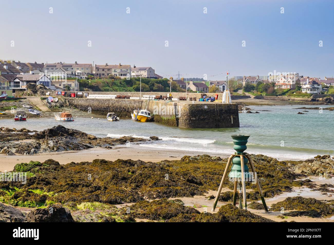 St Patrick's tide bell on the beach in Cemaes Bay, Isle of Anglesey, Wales, UK, Britain Stock Photo