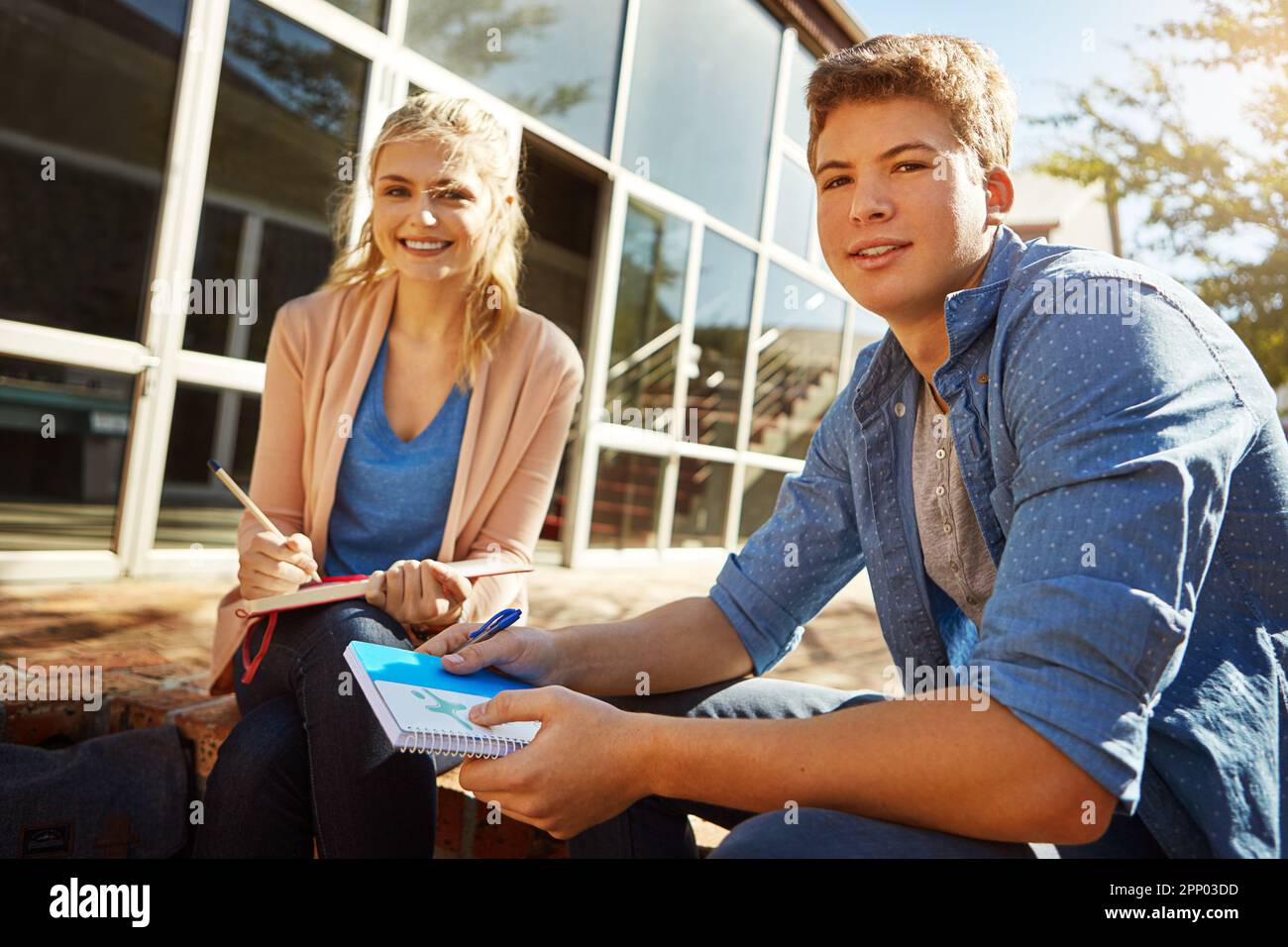 She motivates me. two students studying together on campus Stock Photo ...