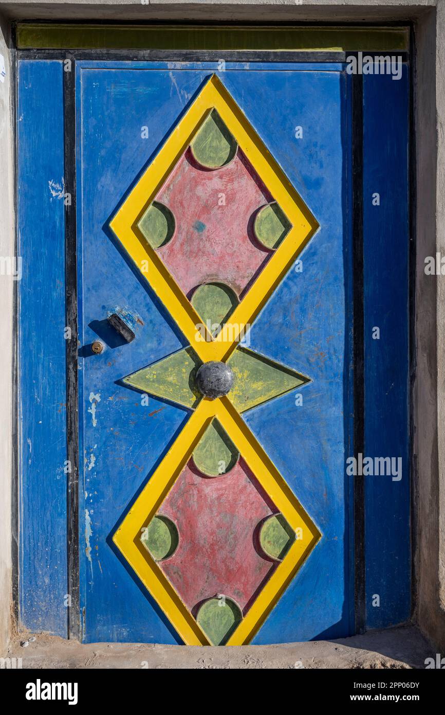 Door of a house decorated with colorful traditional Berber motifs. Stock Photo